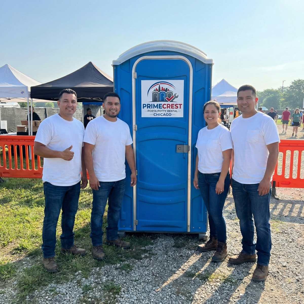 Primecrest team with portable restroom at outdoor event